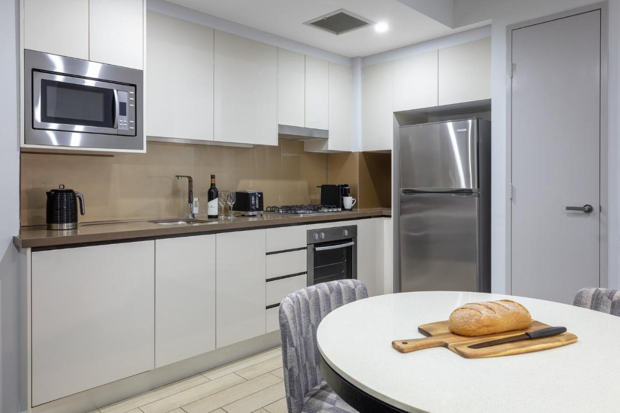 Meriton Suites North Ryde Sydney Exterior photo A typical kitchen in a residential apartment